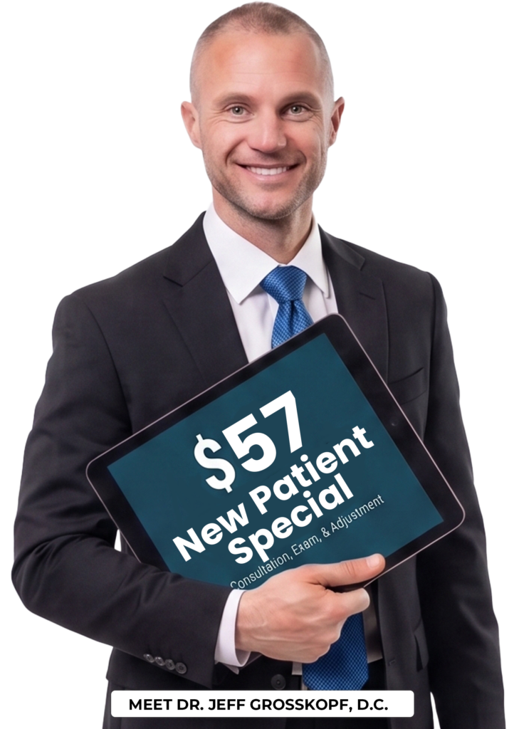 Dr. Jeff holding a new patient special coupon.