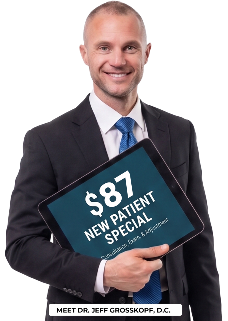 Dr. Jeff holding a new patient special coupon.